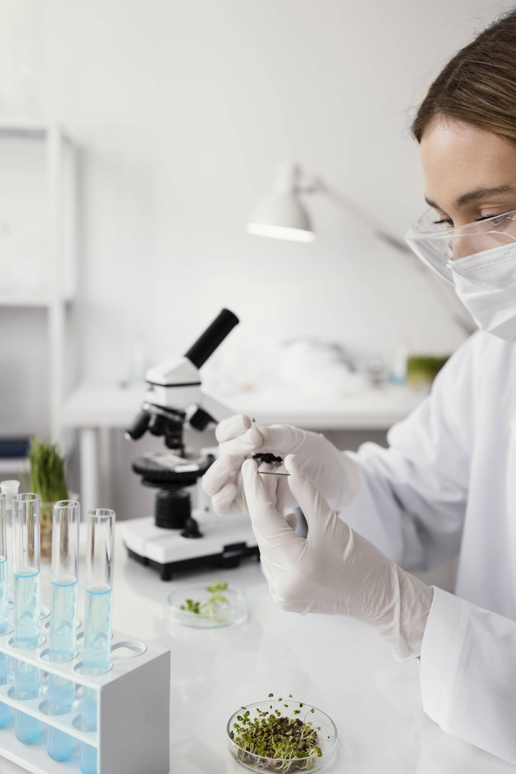 close-up-researcher-holding-slide-glass